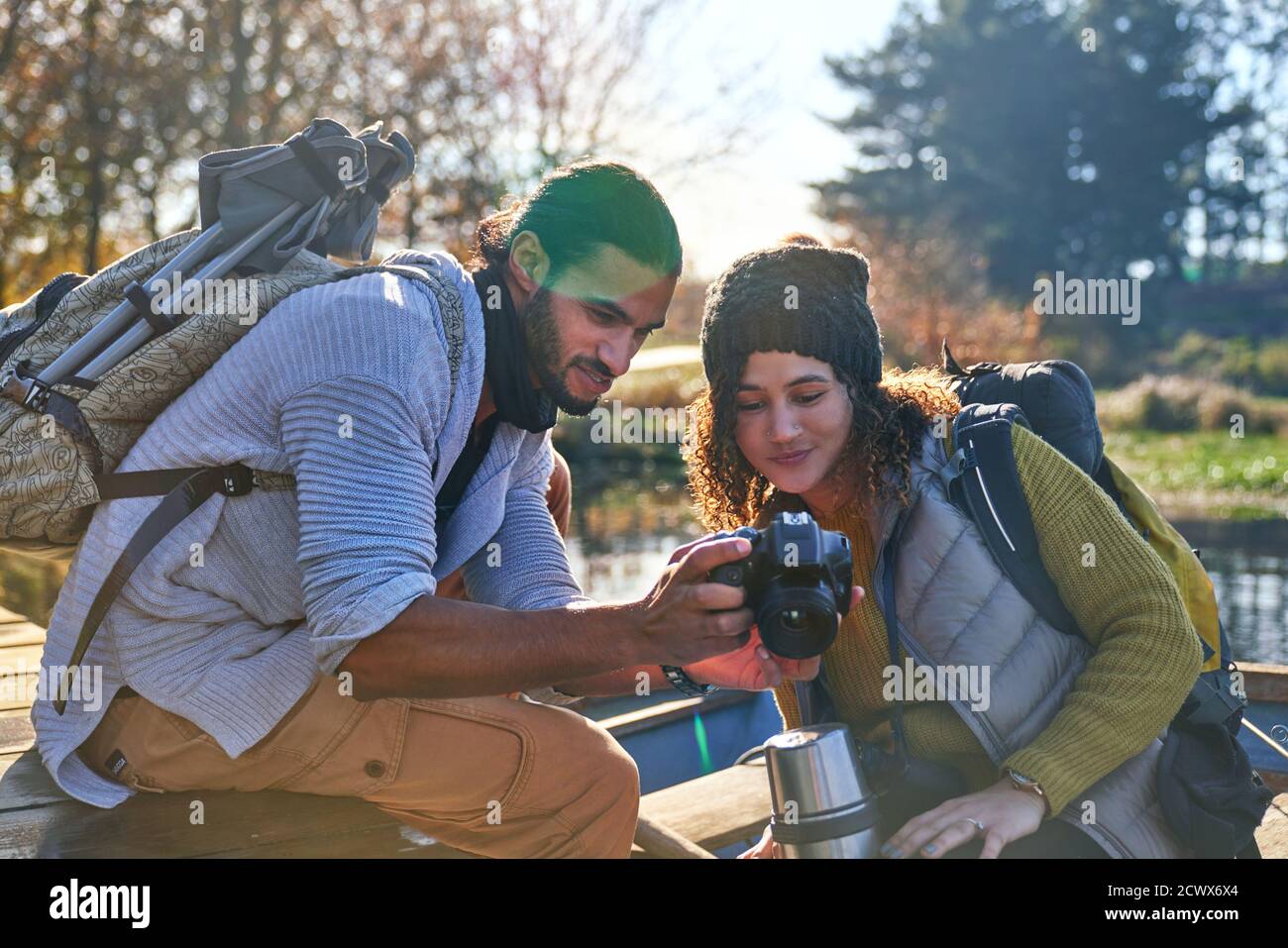 Young hiking couple using digital camera Stock Photo