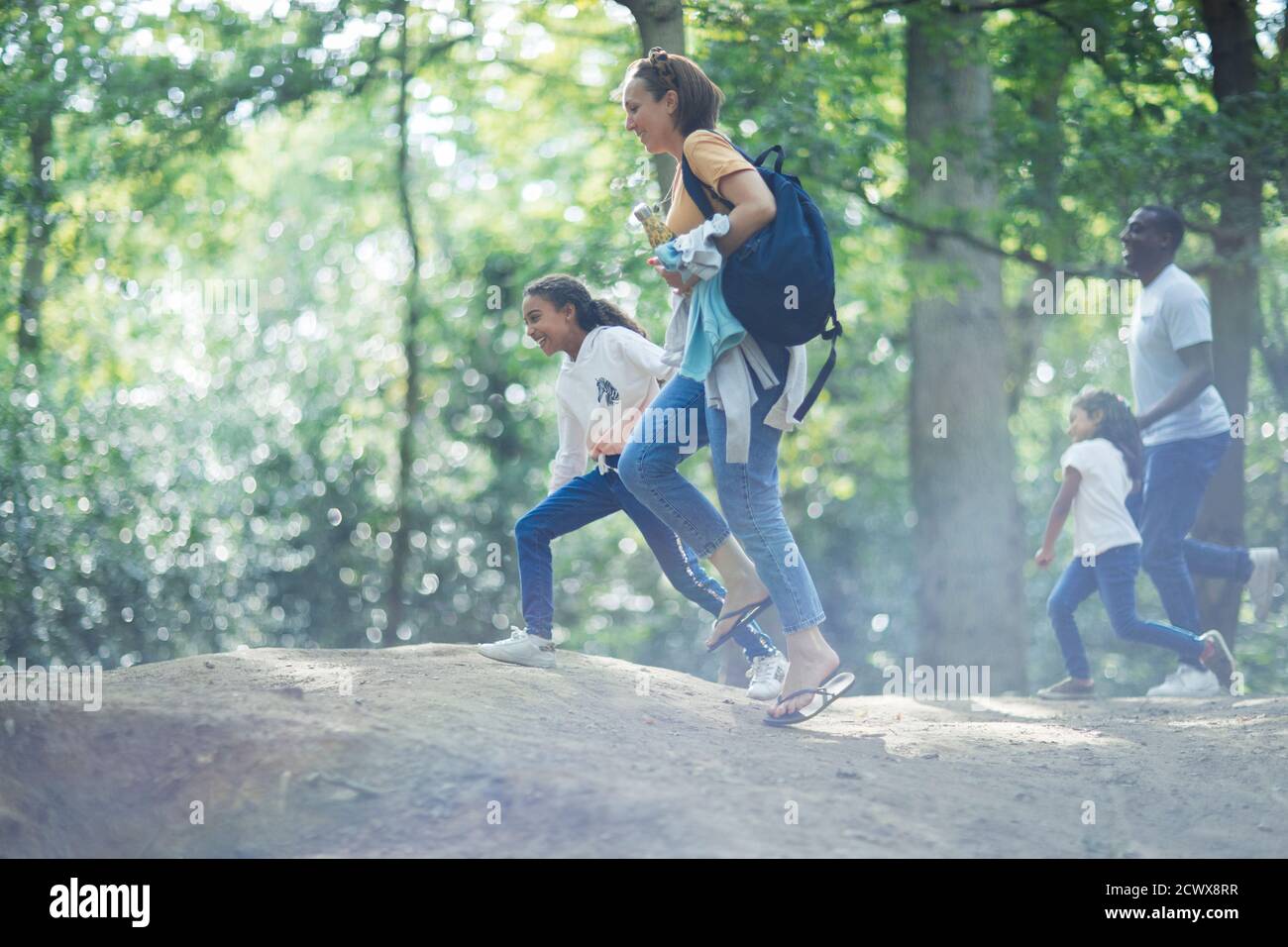Family hiking in woods Stock Photo