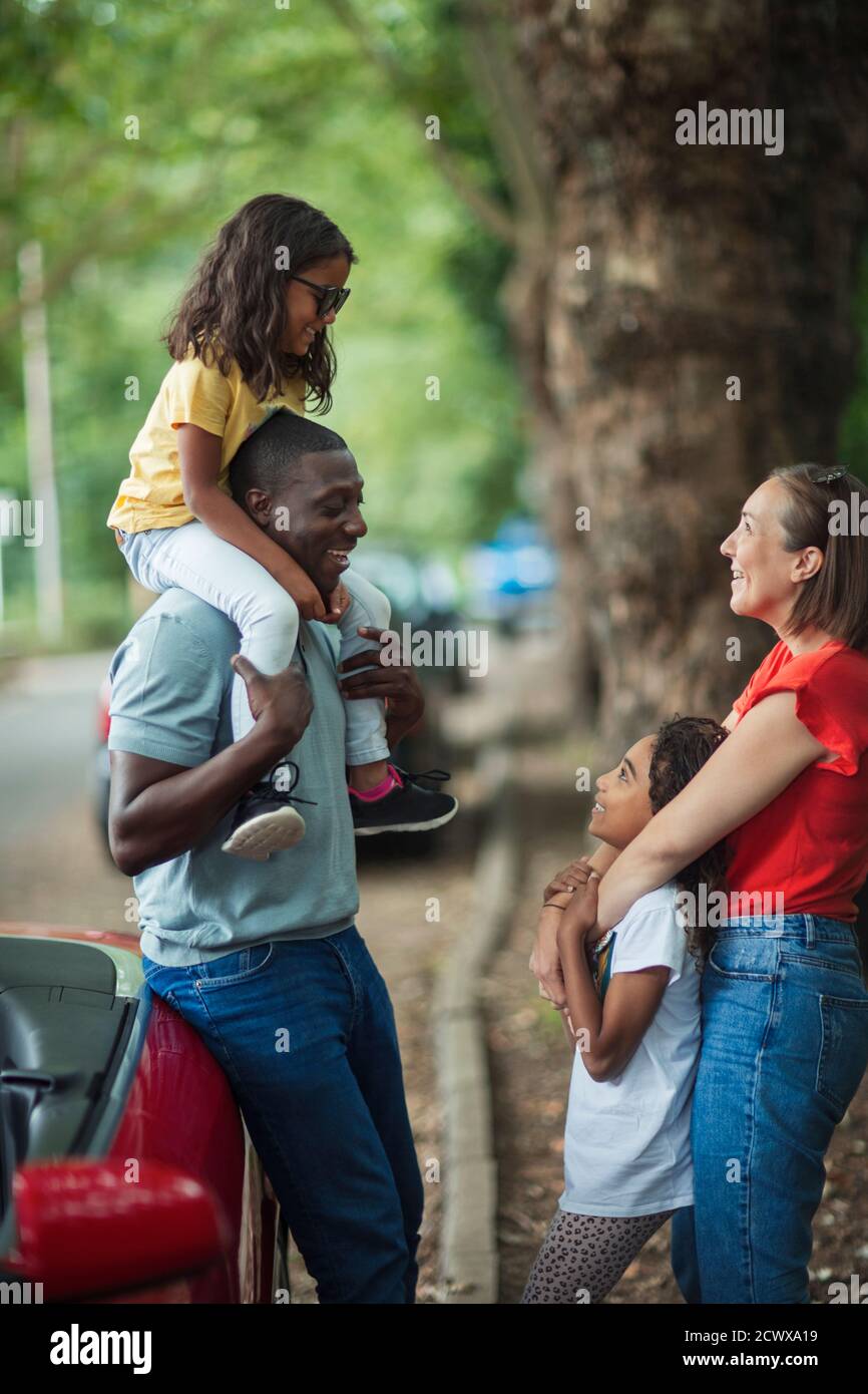 Happy family outside convertible Stock Photo