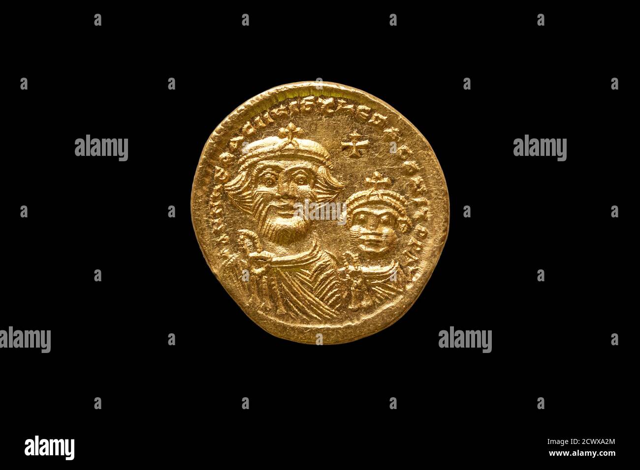 Gold Roman solidus replica coin of Roman Emperor Justinian I AD527-265 cut out and isolated on a black background stock photo Image Stock Photo