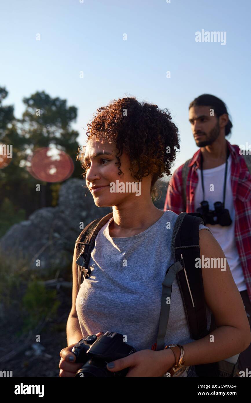 Young couple hiking with camera Stock Photo
