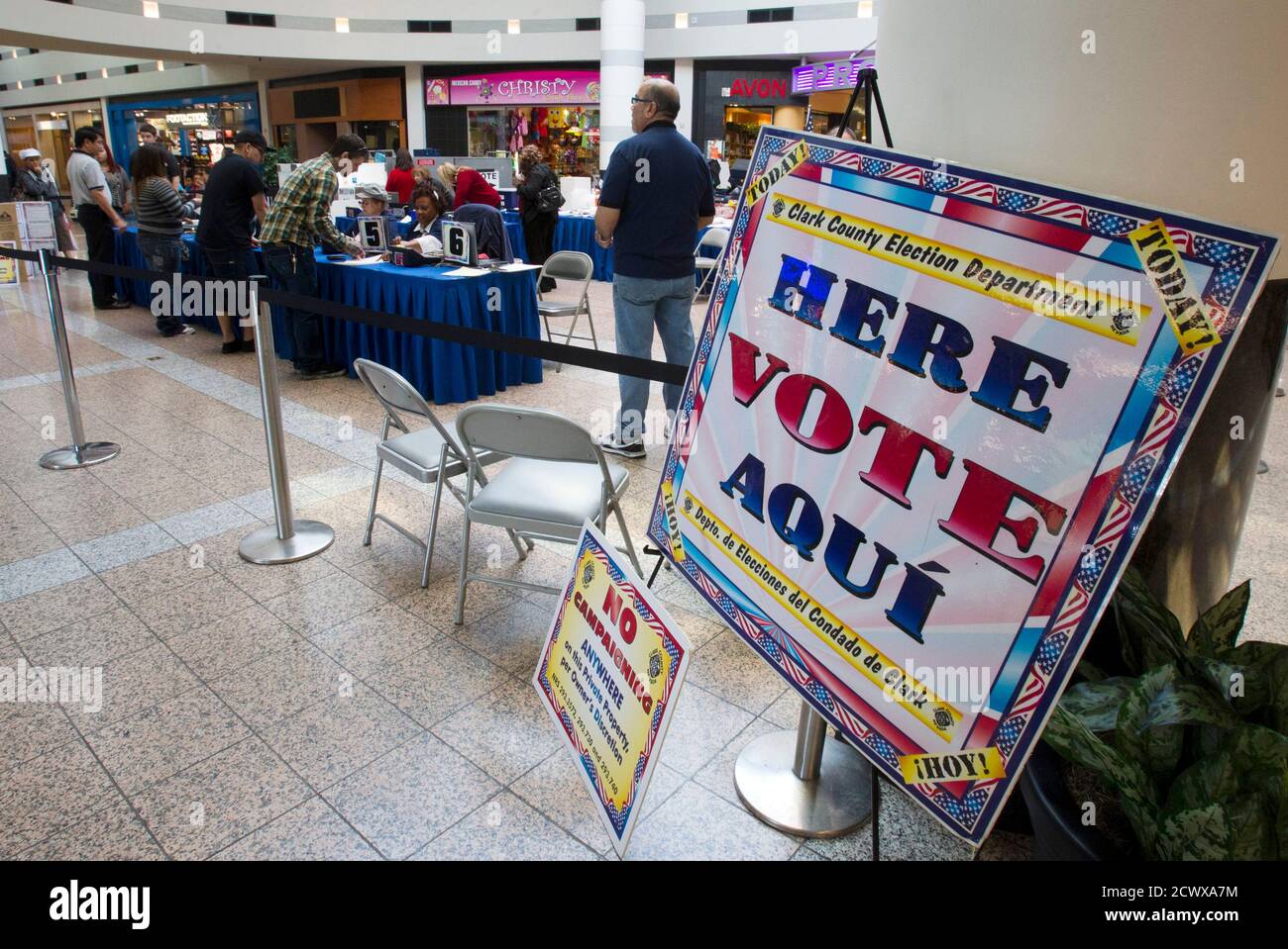 Voters sign in at an early voting location in the Boulevard Mall in Las Vegas, Nevada October 26, 2012. REUTERS/Steve Marcus (UNITED STATES - Tags: POLITICS ELECTIONS USA PRESIDENTIAL ELECTION) Stock Photo