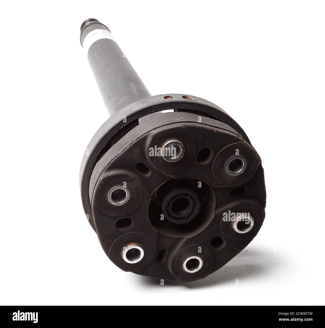 Driveshaft with cardan joint from a car on white isolated background