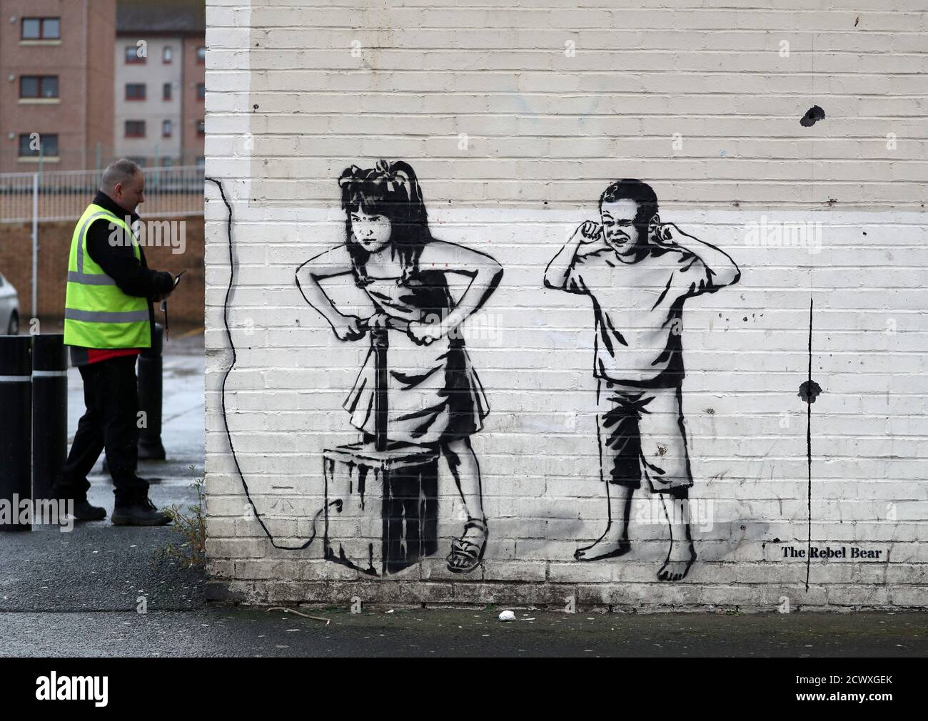 Art work by graffiti artist The Rebel Bear which has recently appeared showing two children about to detonate explosives at a cashline at a shopping centre in Cambuslang. Over recent months the artist has drawn several coronavirus related drawings in Glasgow. Stock Photo