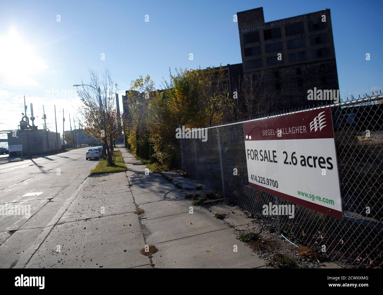 A 'for sale' sign is seen on a fence at a lot of a former business site in Milwaukee November 2, 2012. President Barack Obama and Republican Mitt Romney went back on the attack on Thursday, breaking a storm-induced campaign truce to hit the road and pound home their closing messages in the final stretch of a tight battle for the White House. Obama has a somewhat easier path to 270 electoral votes than Romney, fueled primarily by a small but steady lead in the vital battleground of Ohio - a crucial piece of any winning scenario for either candidate - and slight leads in Wisconsin, Iowa and Neva Stock Photo