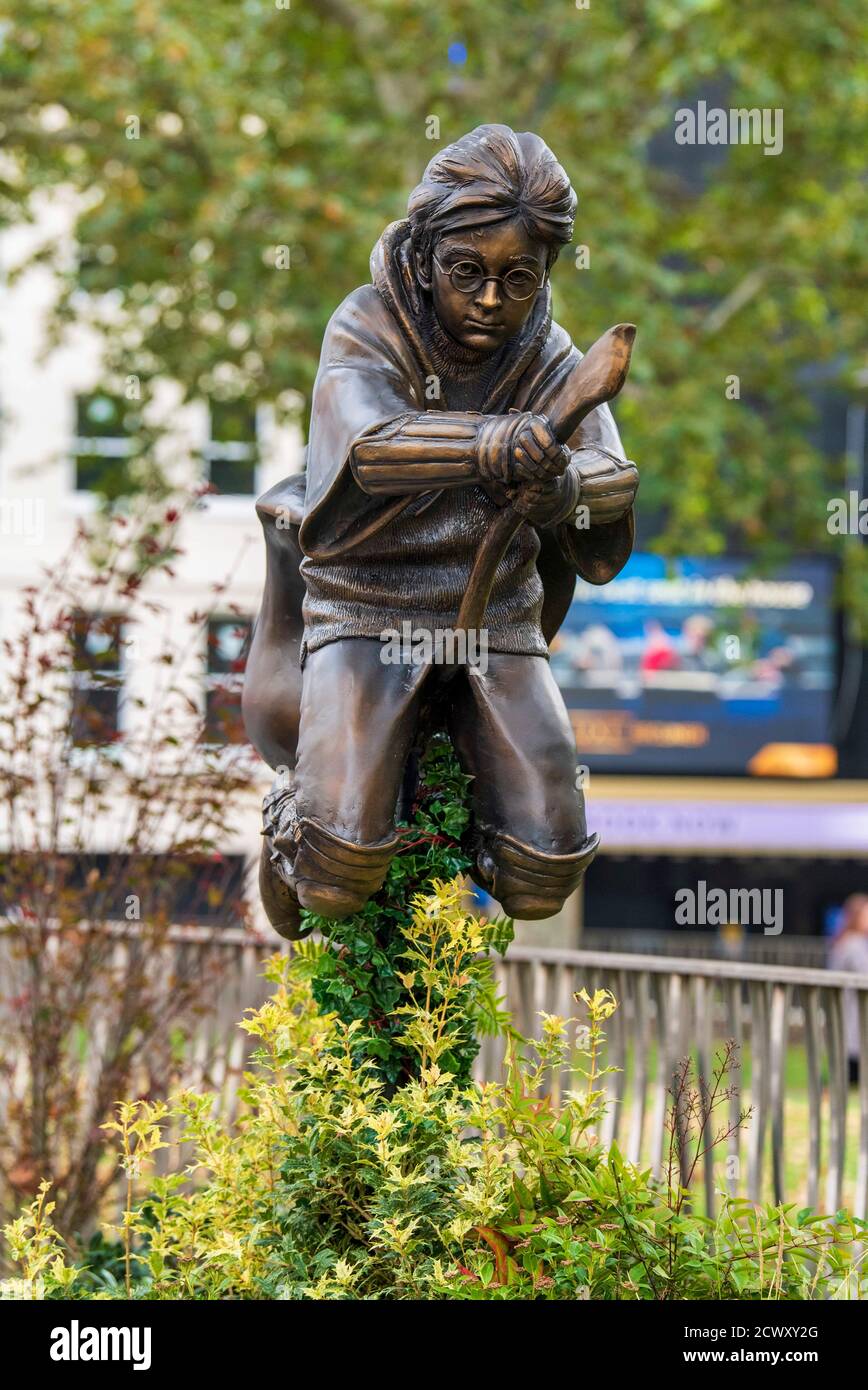A new statue of Harry Potter in Leicester Square, London which has joined the eight other movie statues already in on display there. Stock Photo