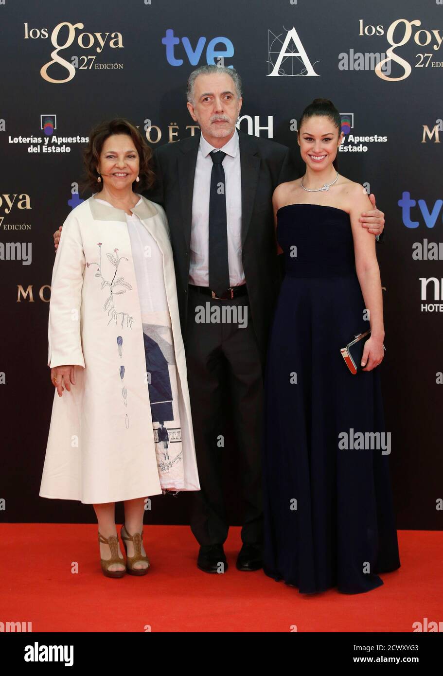 Spanish Director Fernando Trueba (C), nominated as best director, his wife Cristina Huete (L) and actress Aida Folch, nominated as best actress, pose on the red carpet before the Spanish Film Academy's Goya Awards ceremony in Madrid, February 17, 2013..     REUTERS/Sergio Perez (SPAIN - Tags: ENTERTAINMENT) Stock Photo