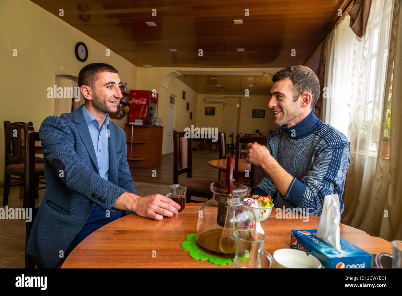 YMCA peace project participants Artak Mkrtchyan (l.), Gerog Sargsyan (r.), meet for tea in the small town of Martouni in Nagorno-Karabakh, about five kilometers from the front. The Caucasus Republic is fought between Armenia and Azerbaijan. Stock Photo