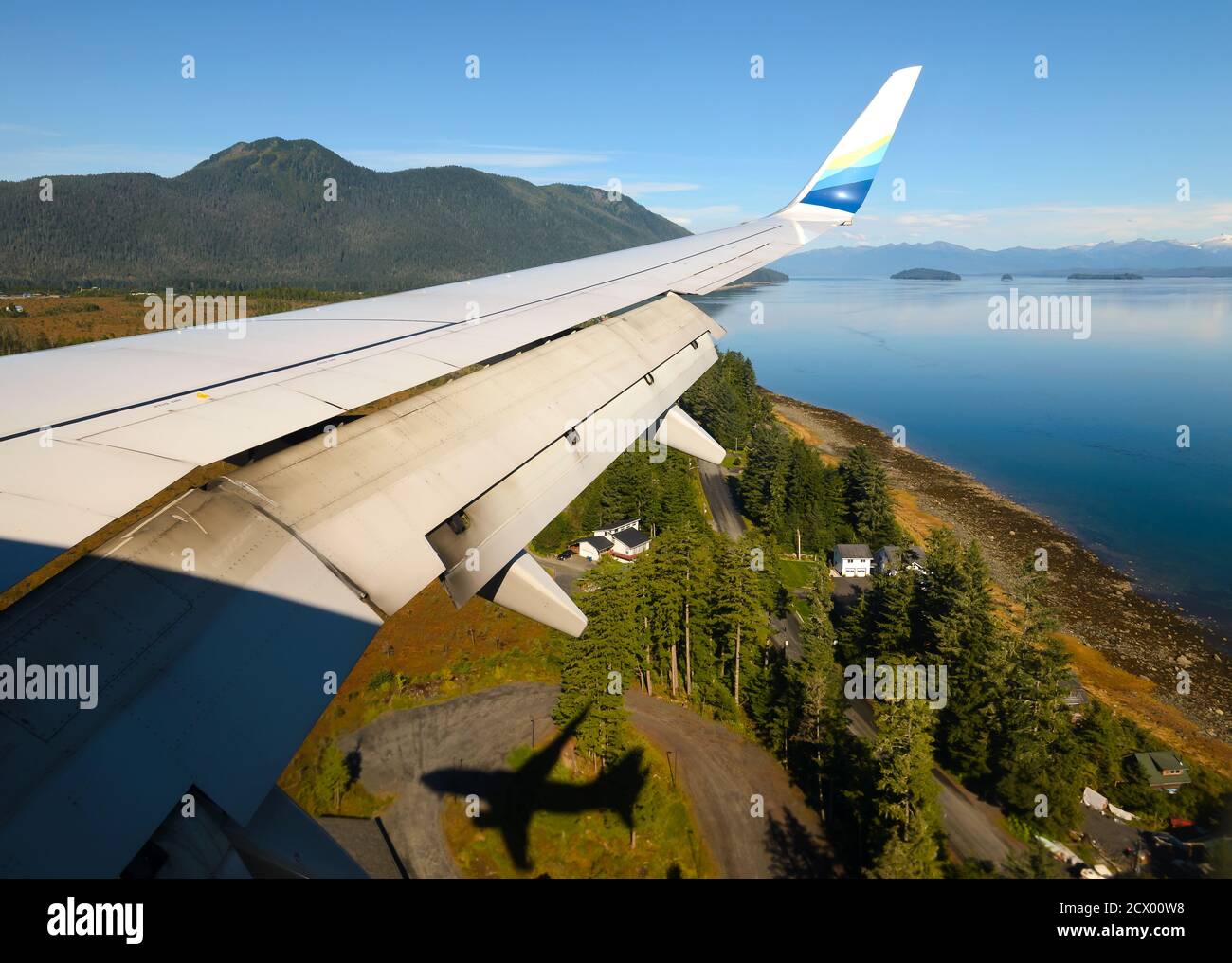 Landing at Petersburg James A. Johnson Airport on board Alaska Airlines Boeing 737. Flight part of Essential Air Service for remote locations. Stock Photo