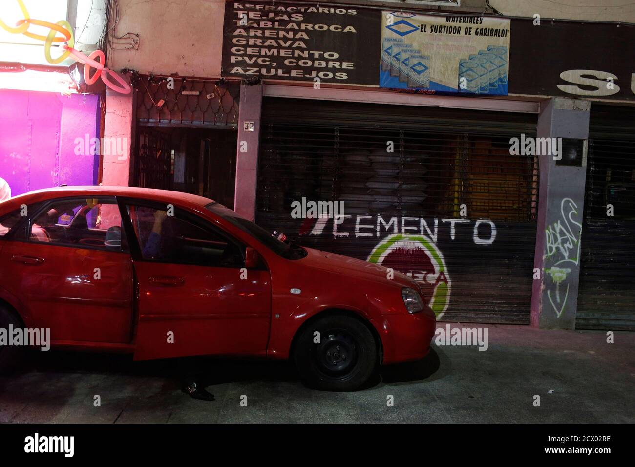 A police agent sits in his vehicle while keeping watch at the entrance of the Palace bar at Plaza Garibaldi in Mexico City May 10, 2013. Malcolm Shabazz was beaten to death early on Thursday morning, police say, in an ignominious end to a short, tormented life flecked with tragedy. Shabazz, the grandson of murdered U.S. civil rights leader Malcolm X, who police say was 29, was visiting Mexico City to visit an immigration activist friend Miguel Suarez who was recently deported from the United States, and to support his cause. On Wednesday night, the pair visited the run-down area around Plaza G Stock Photo