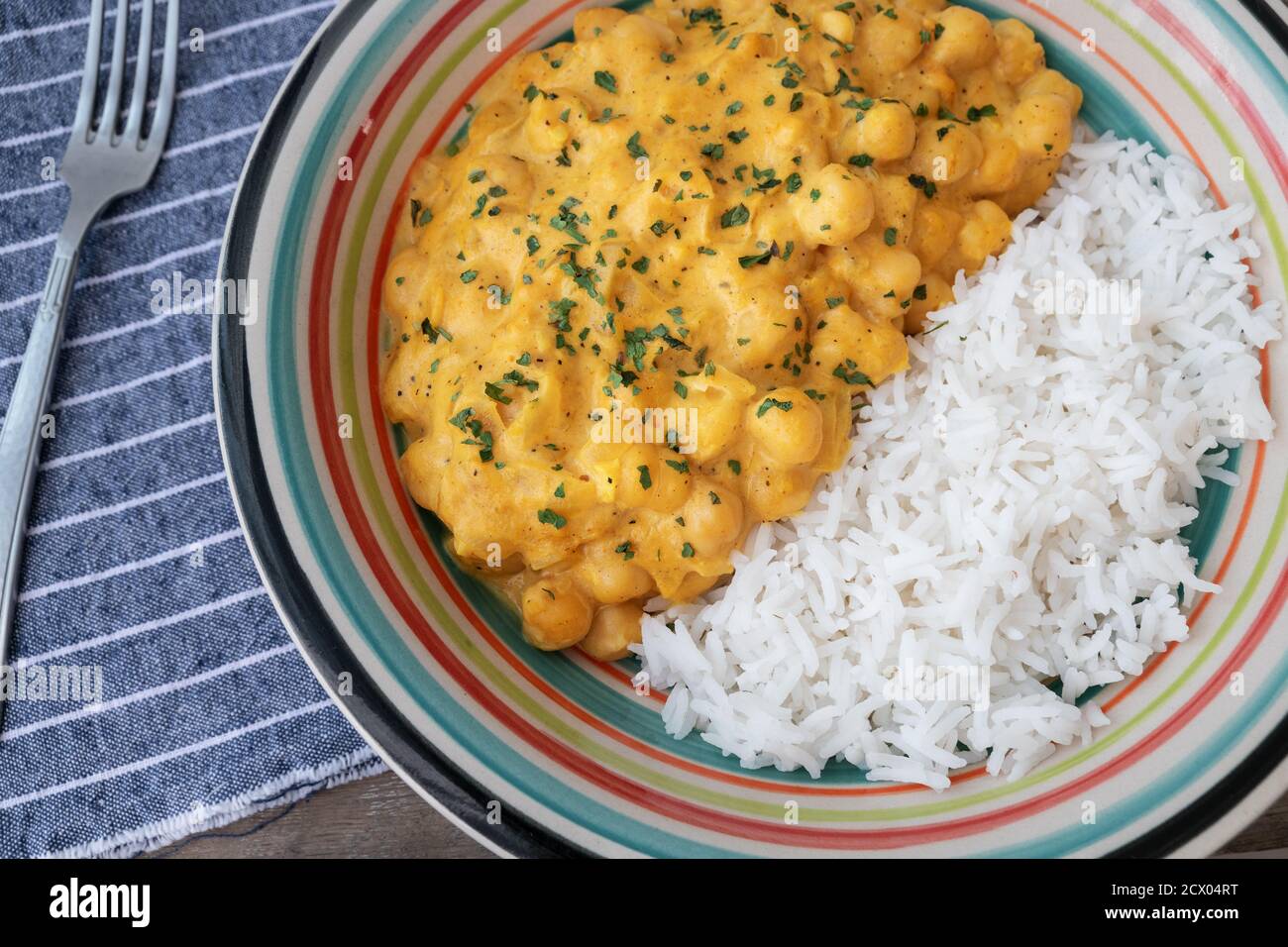 chickpeas with curry accompanied by basmati rice Stock Photo - Alamy