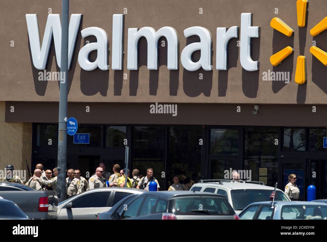 Metro Police officers are shown outside a Walmart after a shooting in Las Vegas June 8, 2014. Las Vegas police said on Sunday that a shooting incident involving officers resulted in injuries and urged people to stay away from the scene. The Las Vegas Metropolitan Police Department said in a tweet that the incident occurred near north Las Vegas, at an address close to a Wal-Mart store. REUTERS/Las Vegas Sun/Steve Marcus (UNITED STATESCRIME LAW) Stock Photo