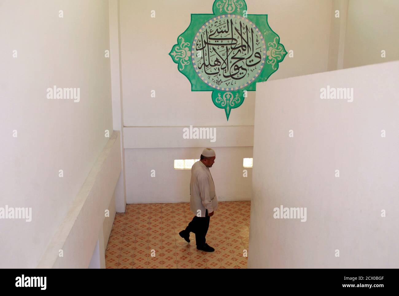 Hamim Sofyan A Teacher Walks Down The Stairs At The Al Mukmin Islamic Boarding School In Solo Indonesia Central Java Province August 2 2011 The Al Mukmin Islamic Boarding School Founded By Indonesian Cleric<script async src=