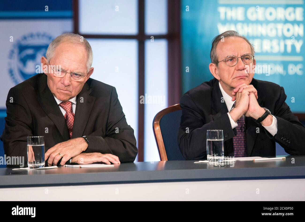 Germany's Minister of Finance Wolfgang Schauble (L) and Italy's Minister of Economy and Finance Pier Carlo Padoan participate in a discussion on 'A Reform Agenda for Europe's Leaders' during the World Bank/IMF annual meetings in Washington October 9, 2014.      REUTERS/Joshua Roberts    (UNITED STATES - Tags: POLITICS BUSINESS) Stock Photo