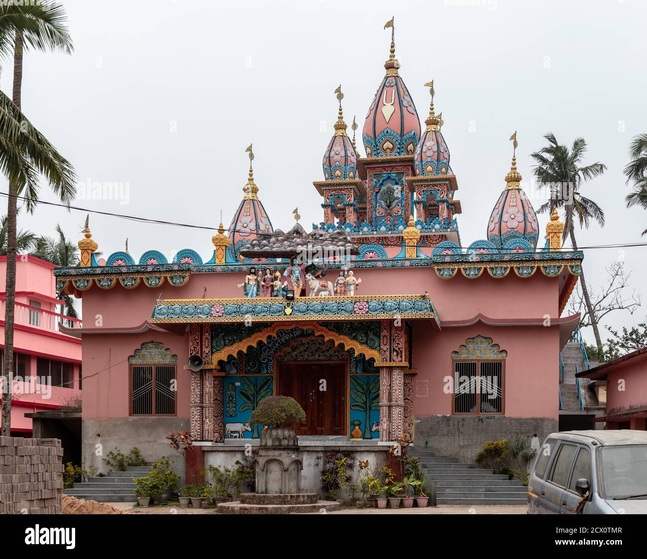 Puri, India - February 3, 2020: A pink and blue decorative hindu temple against the sky on February 3, 2020 in Puri, India Stock Photo