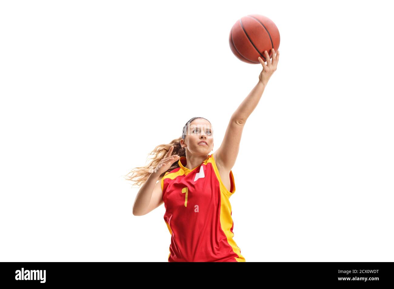 Female basketball player doing layup isolated on white background Stock Photo