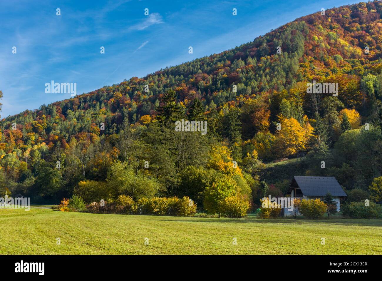 Autumn landscape with small house and colorful trees near Graz, Styria ...