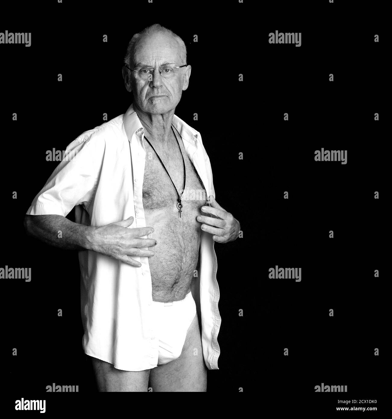 September 2020 - Mature caucasian guy of 64 undressing. Stock Photo