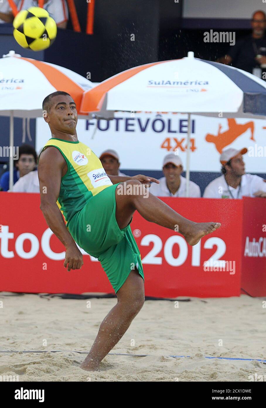 Former soccer star Romario of Brazil 2 kicks the ball against Spain during  their Fut-volley World Championships on Ipanema beach in Rio de Janeiro  April 1, 2011. Fut-volley is a combination of