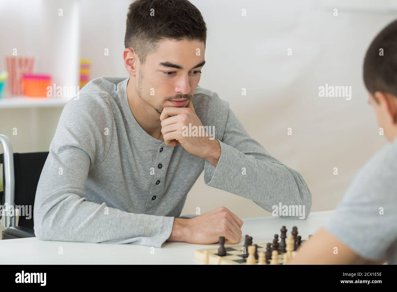 two students concentrated playing chess Stock Photo