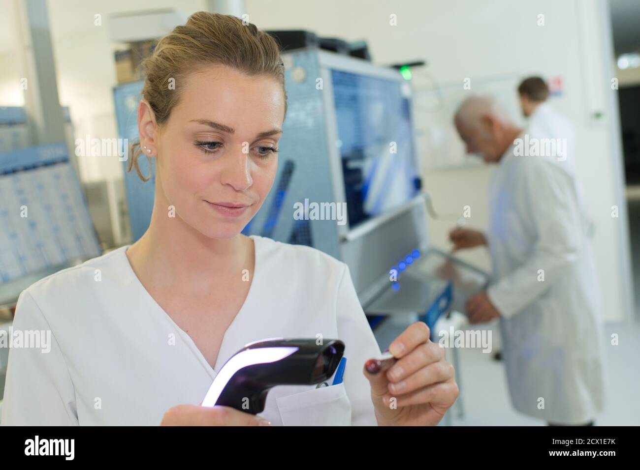 samples from medical tests are loaded into the device Stock Photo Alamy