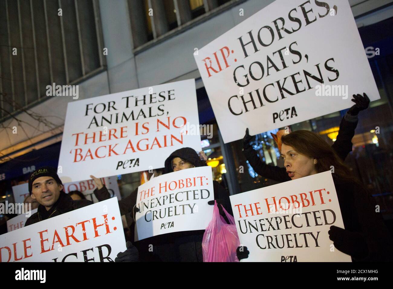 Protesters from the animal rights group PETA protest at the premiere of the film 'The Hobbit: An Unexpected Journey' in New York December 6, 2012. The group claims that numerous animals suffered from fatal injuries during the production of the film. Director Peter Jackson has said some animals died on a farm where they were housed, but none had been hurt during filming.  REUTERS/Andrew Kelly (UNITED STATES - Tags: ENTERTAINMENT CIVIL UNREST) Stock Photo