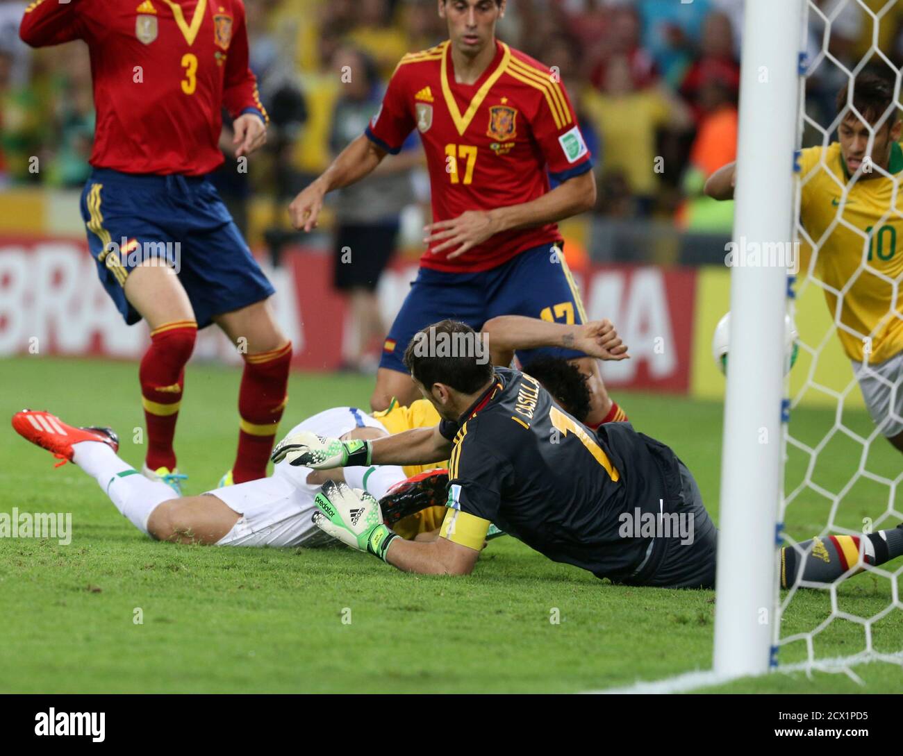 Brazil S Fred Bottom In Yellow Kicks To Score A Goal Past Spain S Goalkeeper Iker Casillas Bottom In Black During Their Confederations Cup Final Soccer Match At The Estadio Maracana In Rio De