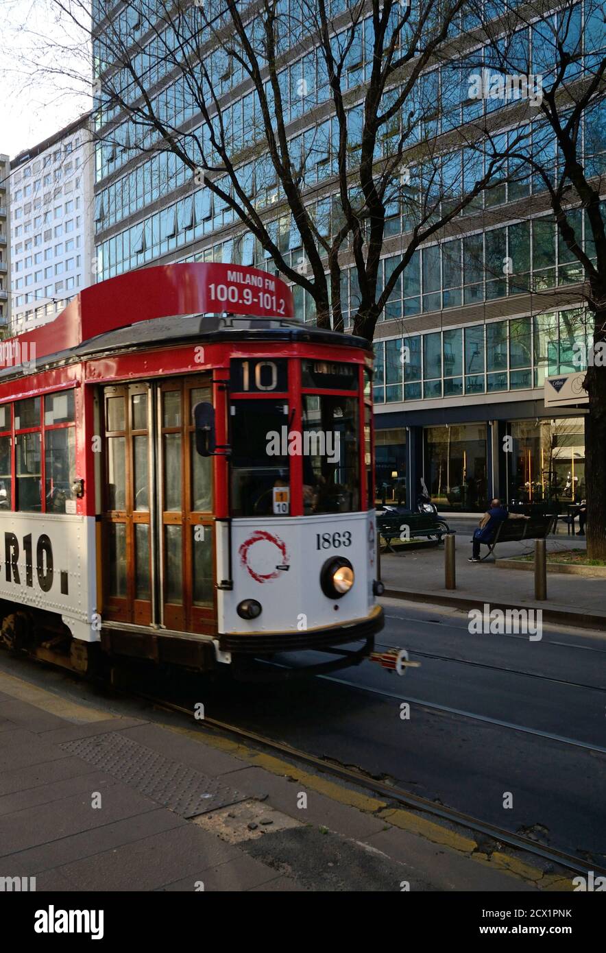 typical old tram passing in a city street Stock Photo