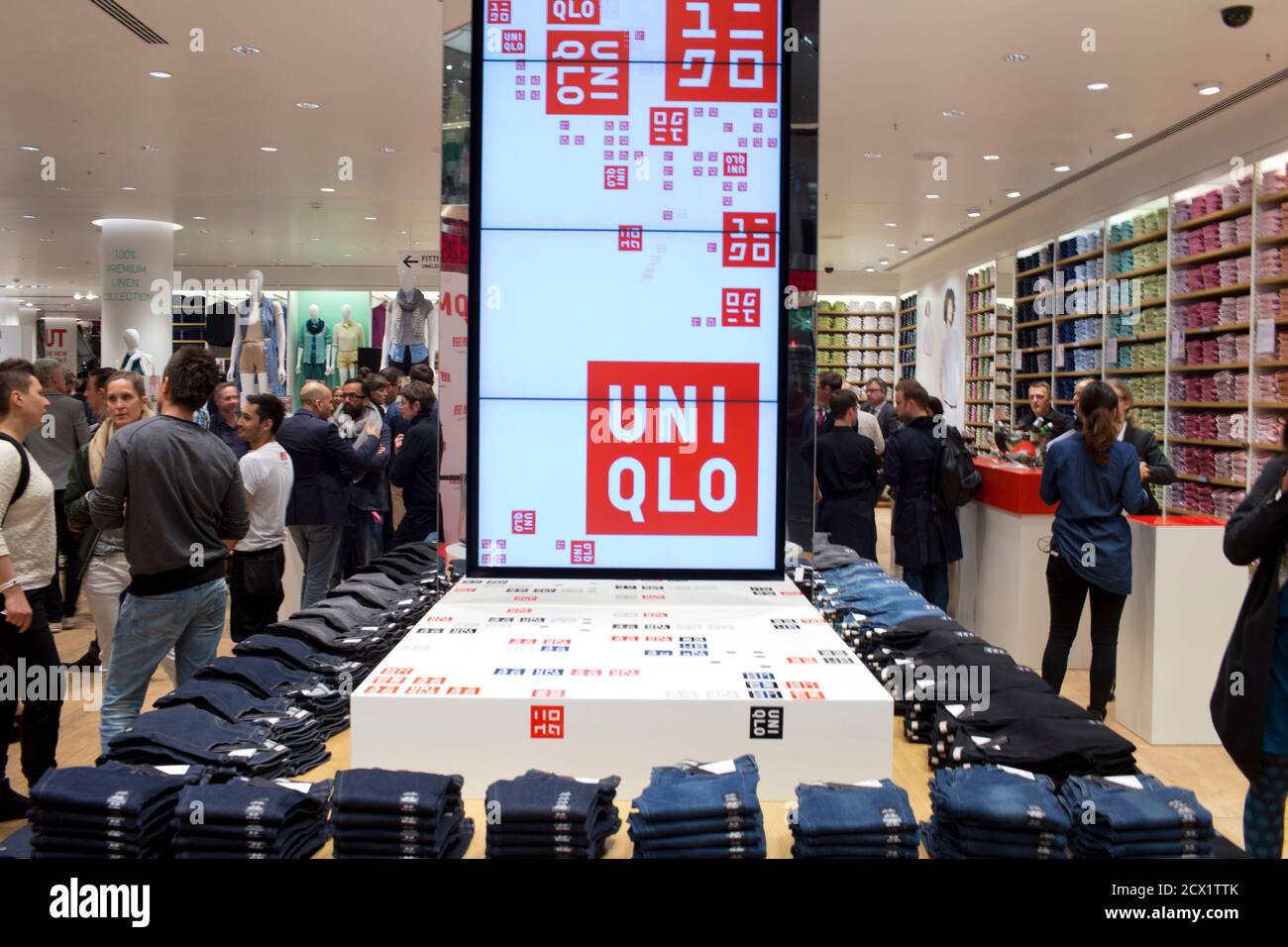 People visit the Uniqlo Global flagship store during a preopening in Berlin,  April 10, 2014. Japanese casual wear chain Uniqlo opens its first store in  Germany on Friday, as it accelerates expansion