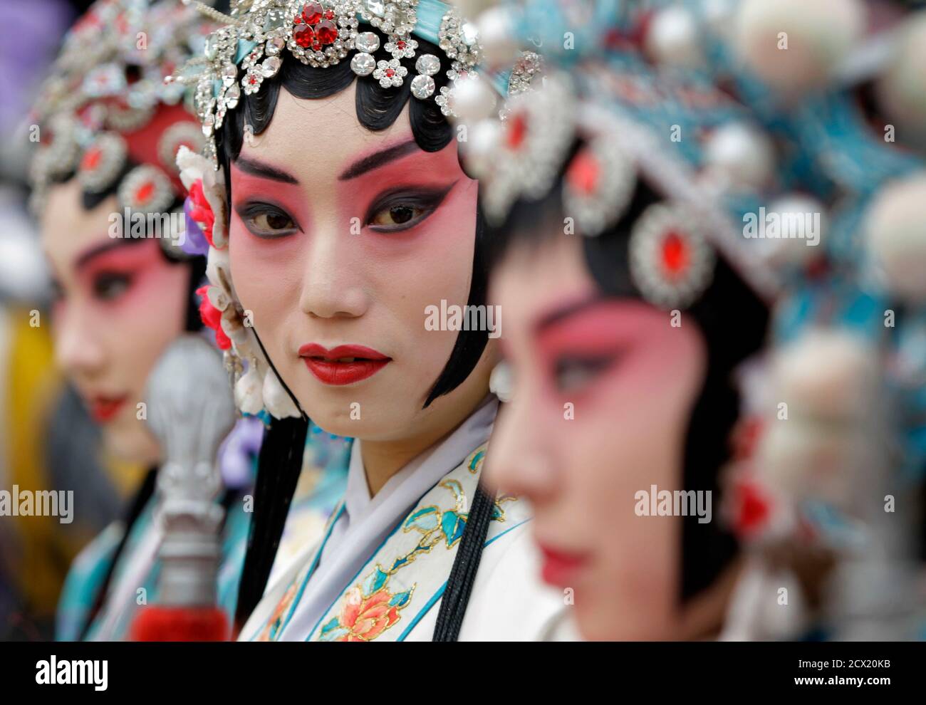 Chinese Peking Opera performers wait for the opening ceremony of 12th Beijing International Tourism Festival at Qianmen Commercial Street, in Beijing, September 19, 2010. REUTERS/Jason Lee (CHINA - Tags: TRAVEL SOCIETY) Stock Photo