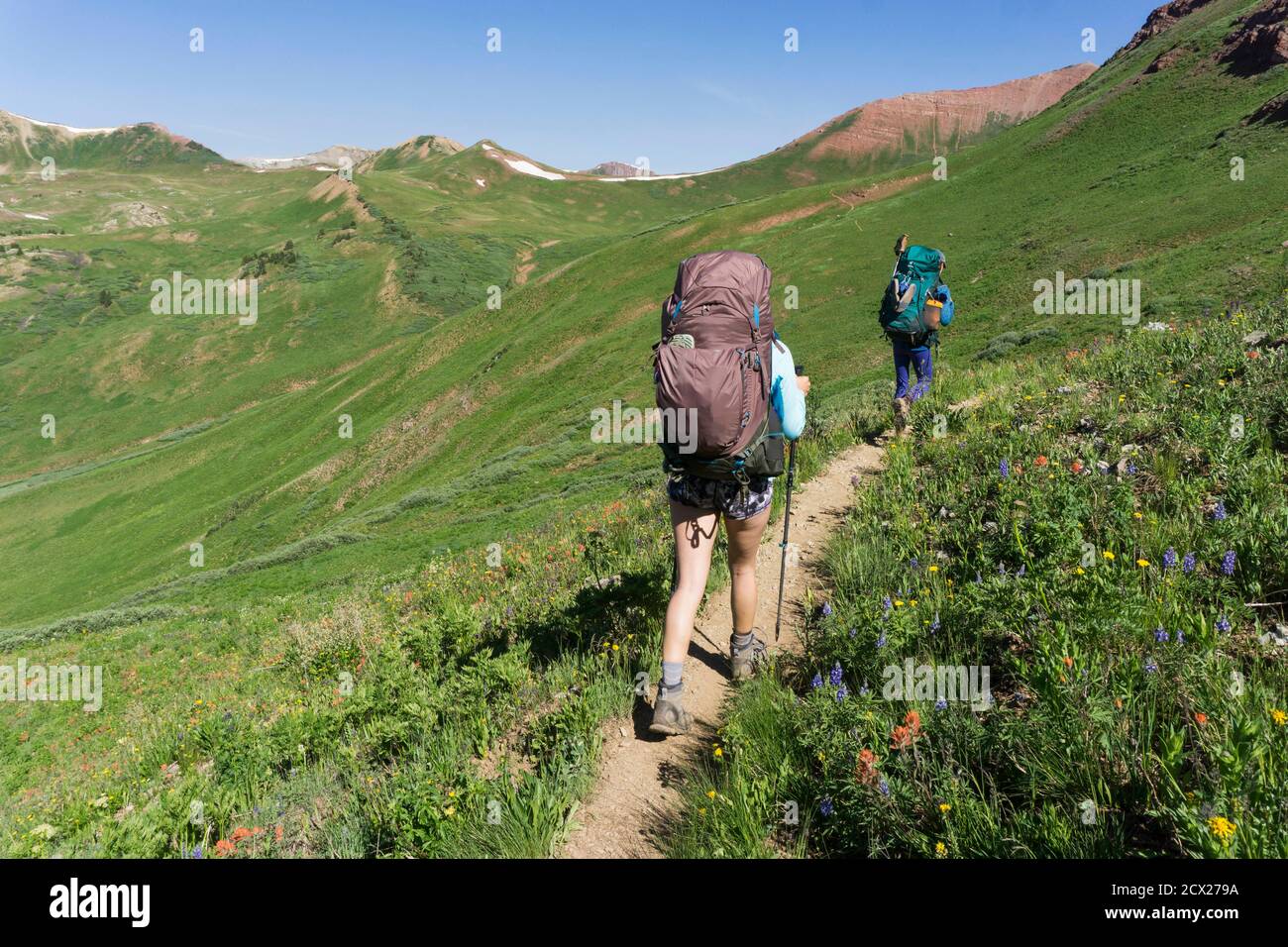 Four hikers walking on mountain hi-res stock photography and images - Alamy