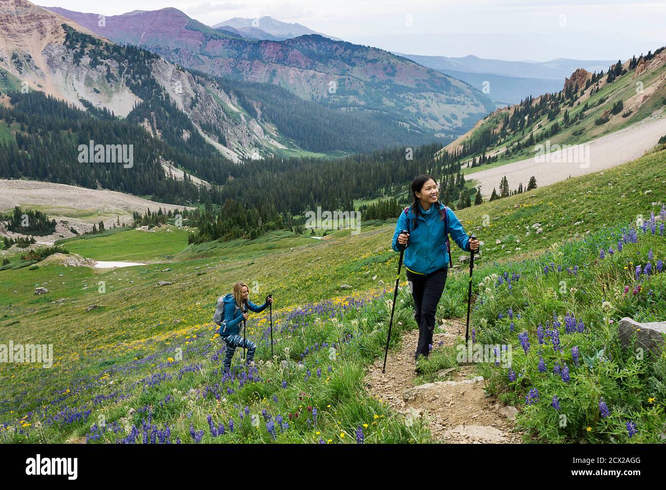 Friends walking on peak mountain hi-res stock photography and images ...