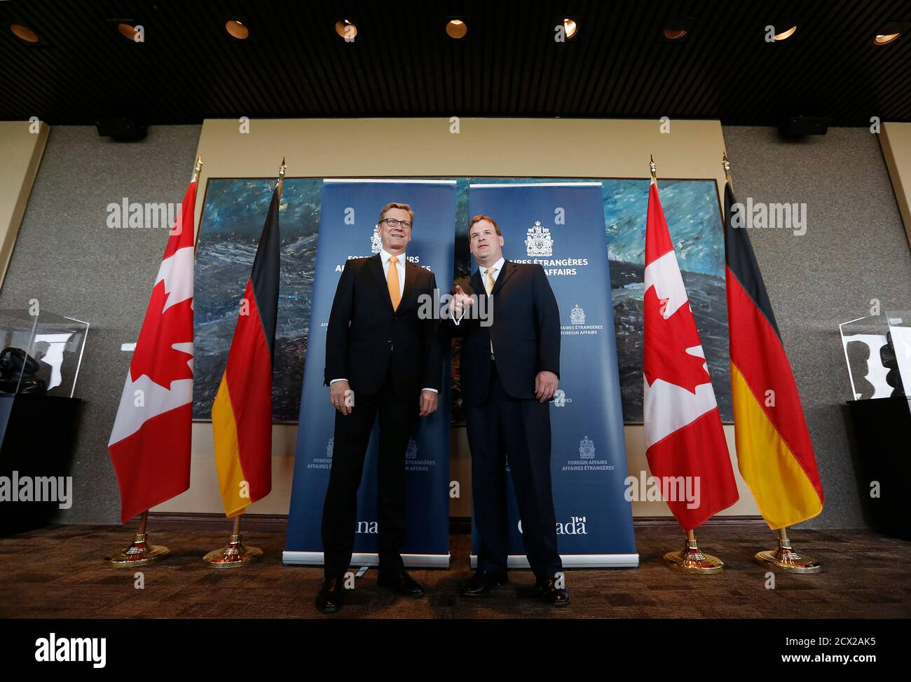Canada's Foreign Minister John Baird (R) talks to his German counterpart Guido Westerwelle at the Lester B. Pearson Building in Ottawa May 30, 2013. REUTERS/Chris Wattie (CANADA - Tags: POLITICS) Stock Photo