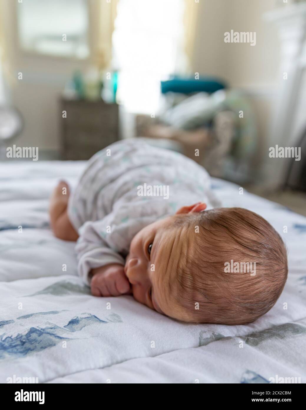 Boy laying on stomach hires stock photography and images Alamy