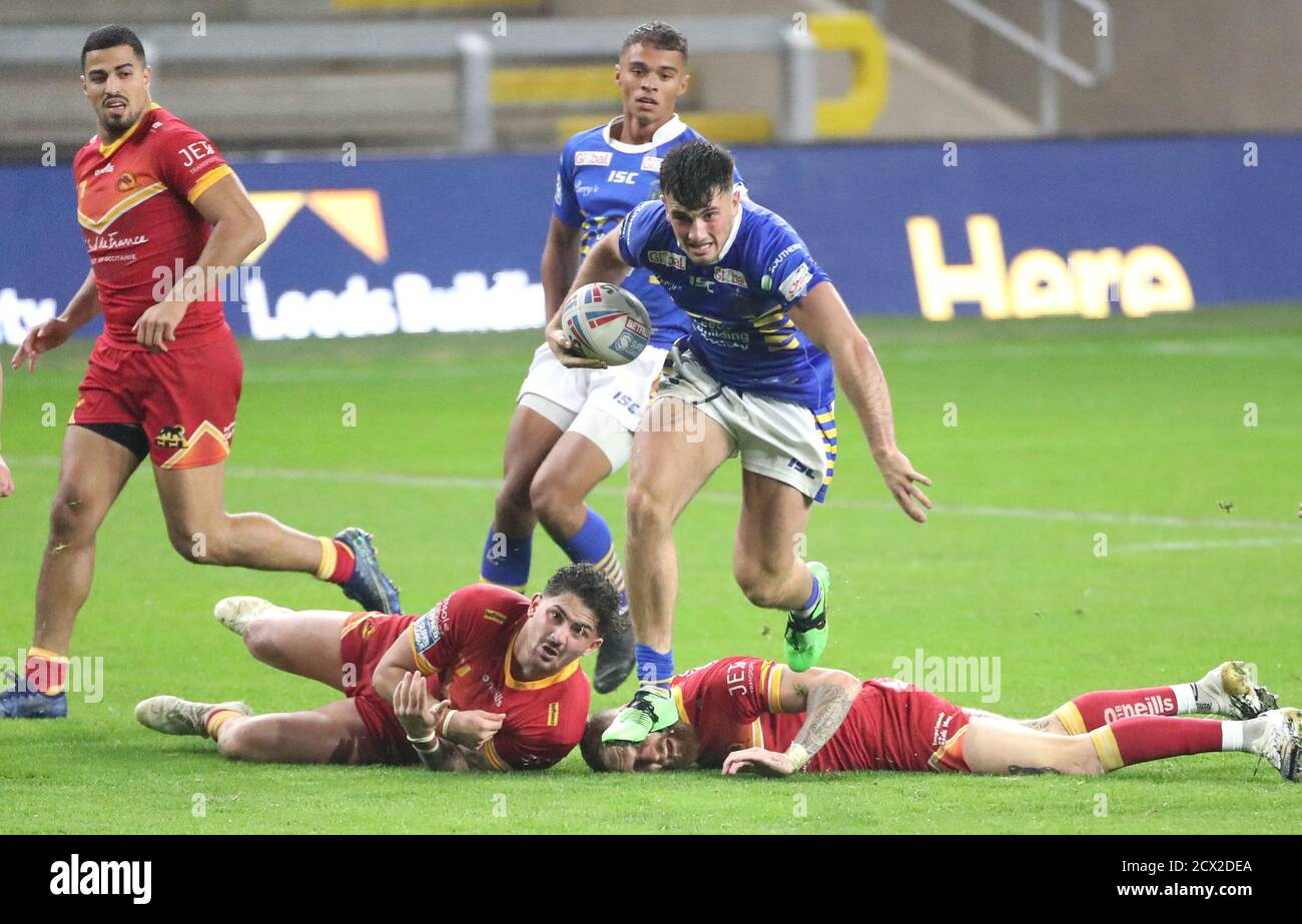 Leeds Rhinos' Liam Tindall (centre) makes a break past during the Betfred Super League match at the Emerald Headingley Stadium, Leeds. Stock Photo