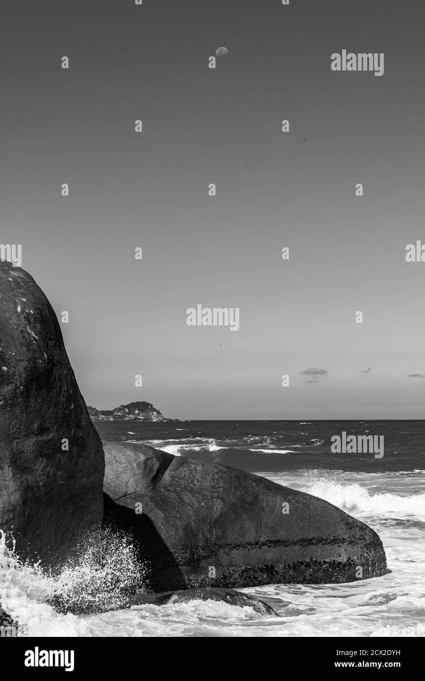 Black and white photo of rocks in the ocean shore in Brazil Stock Photo ...