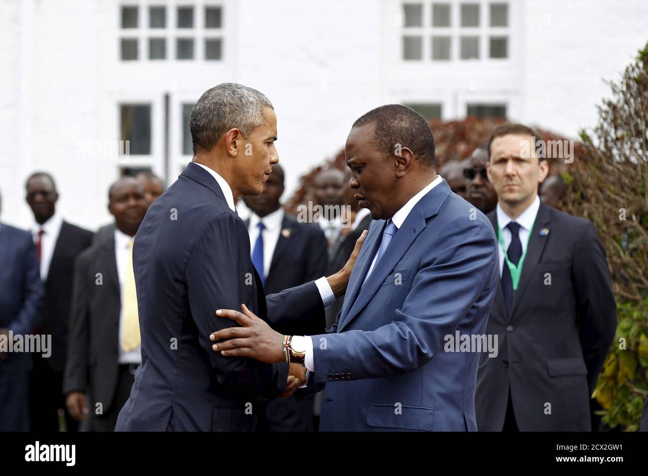 U.S. President Barack Obama (L) meets Kenya's President Uhuru Kenyatta (R) as he arrives for a visit at the State House in Kenya's capital Nairobi, July 25, 2015. REUTERS/Thomas Mukoya Stock Photo