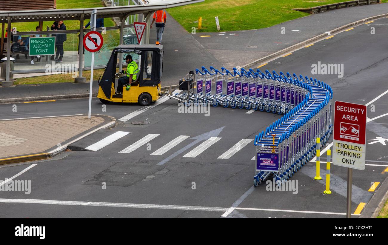 Auckland, New Zealand A baggage cart mover is returning stray baggage