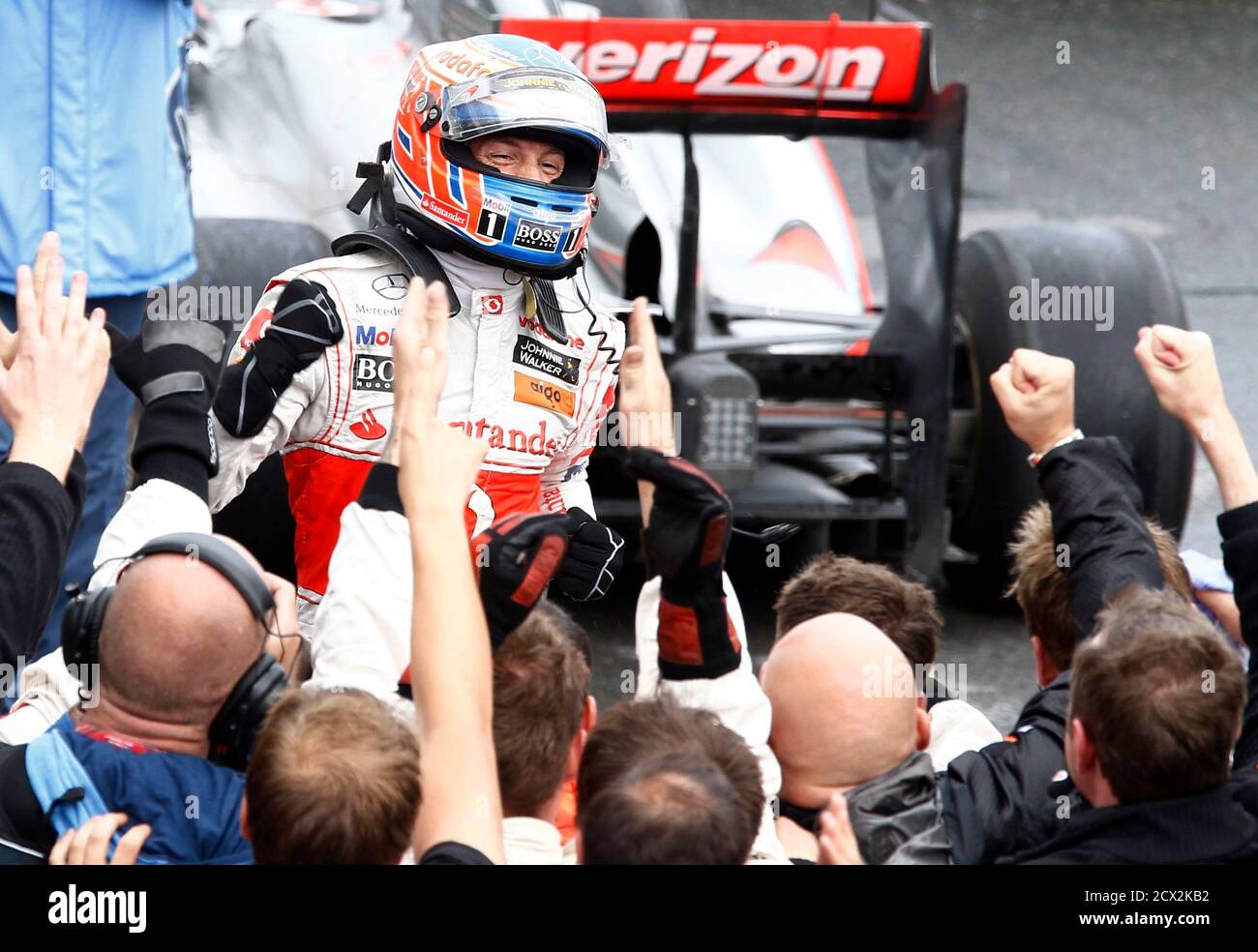 McLaren Formula One driver Jenson Button of Britain celebrates after winning the Canadian F1 Grand Prix at the Circuit Gilles Villeneuve in Montreal June 12, 2011.     REUTERS/Chris Wattie (CANADA  - Tags: SPORT MOTOR RACING) Stock Photo