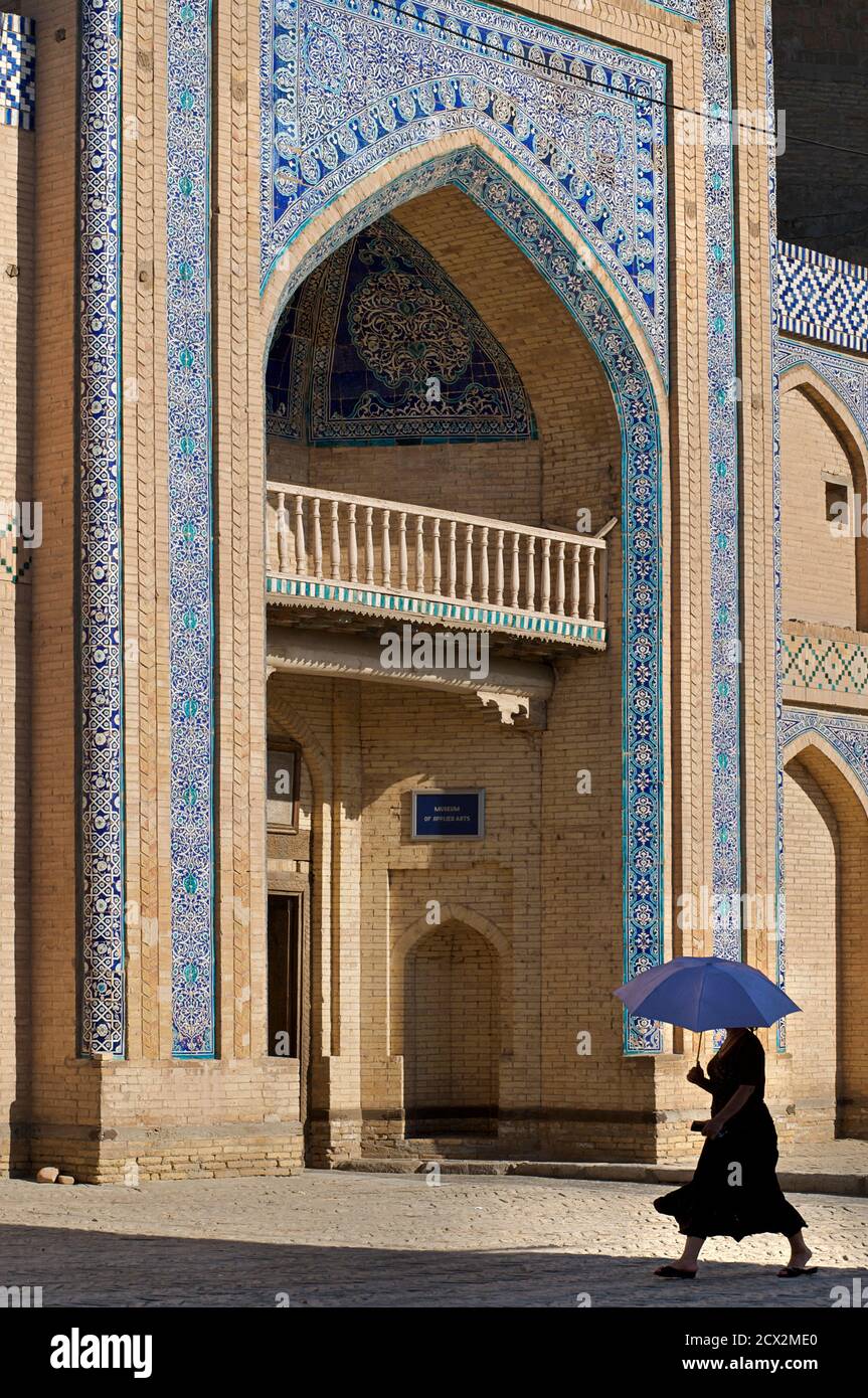 Islom Xo'ja Majuasi, now Museum of Applied Arts, Old Khiva, Uzbekistan. Woman with parasol Stock Photo