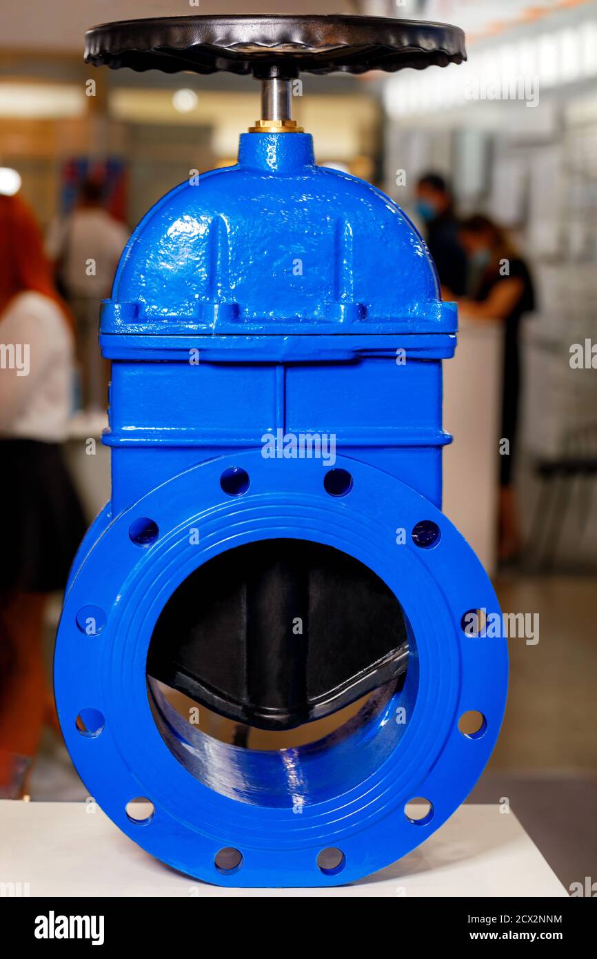 Industrial shut-off valve of large diameter with a rubberized wedge as a locking device to prevent further movement of the flow of cold or hot water. Stock Photo