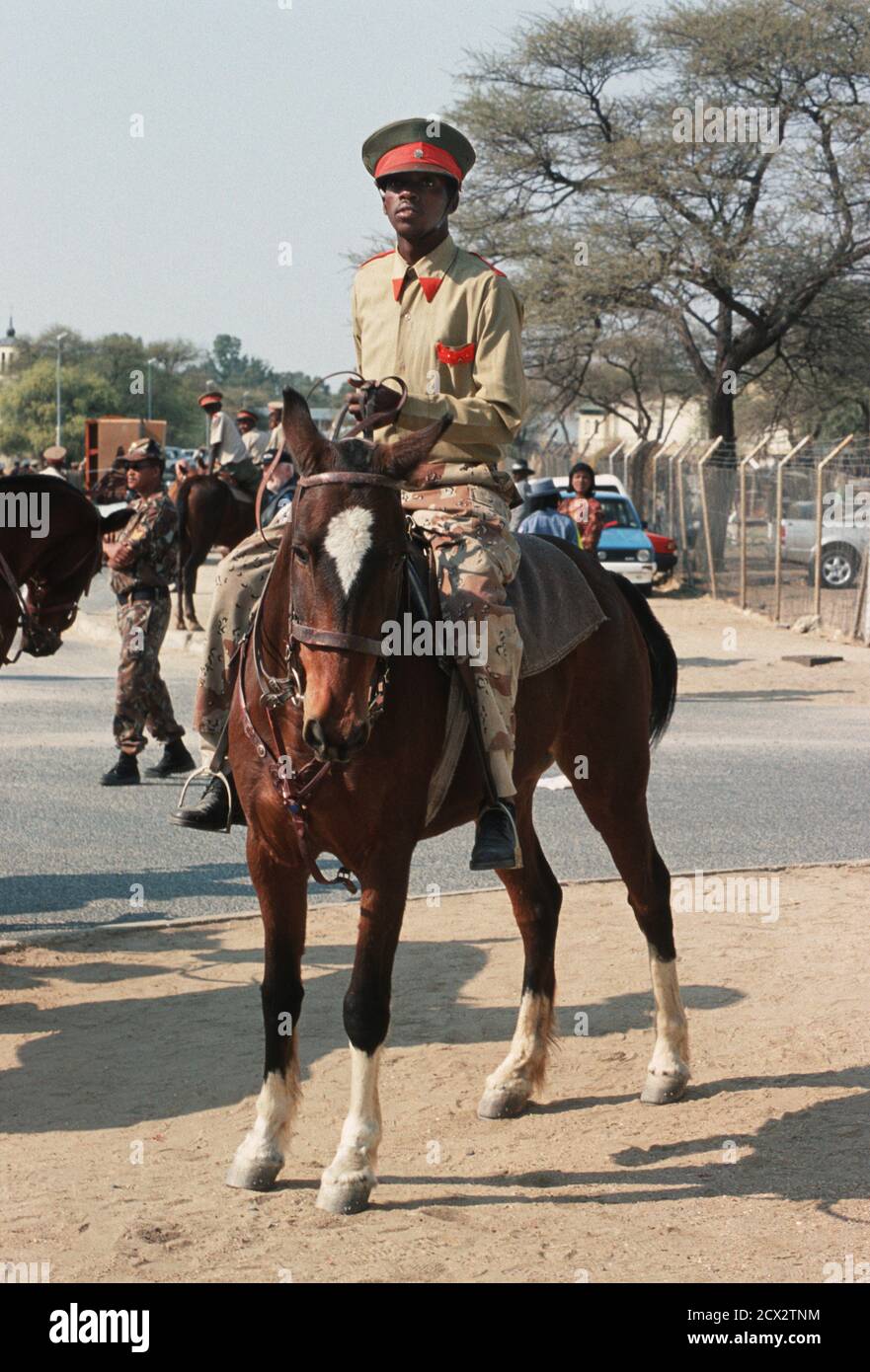 Member of paramilitary style group in uniform and on horseback for the main Herero festival.  Celebrations are held in Okahandja on Maherero day, which falls on the last weekend in August.  Various paramilitary style groups parade before their chiefs. The Herero are a pastoral cattle breeding people. It is thought they migrated from the east African lakes area, arriving in Namibia in the 17th century. Their initial home was in Kaokoland near the Kunene River, but c.1850 a large portion of the Herero population moved southwards leaving the Himba and Tjimba tribal groups. Okahandja, Namibia Stock Photo