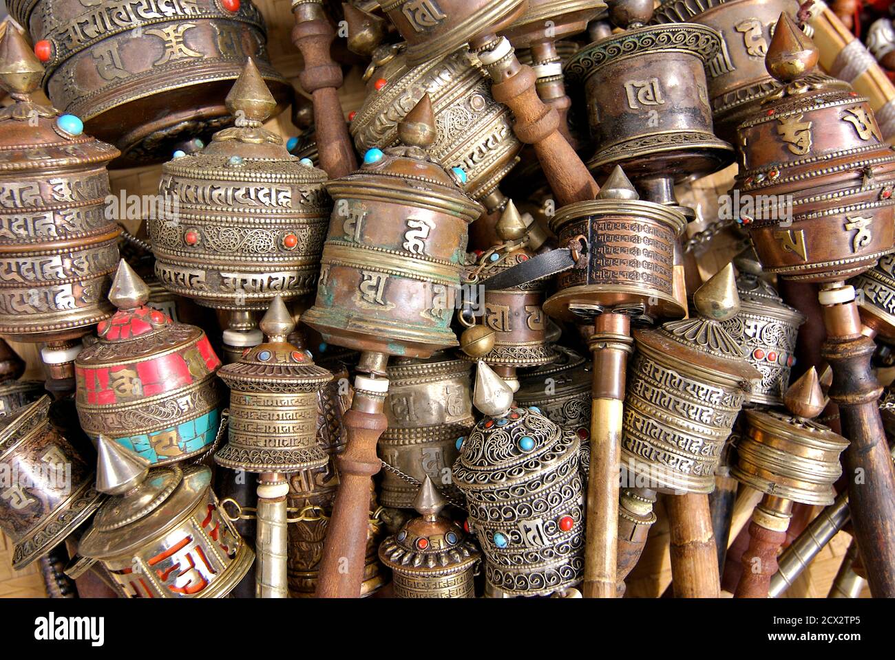 Nepalese and Tibetan handicrafts prayer wheels for sale on a market