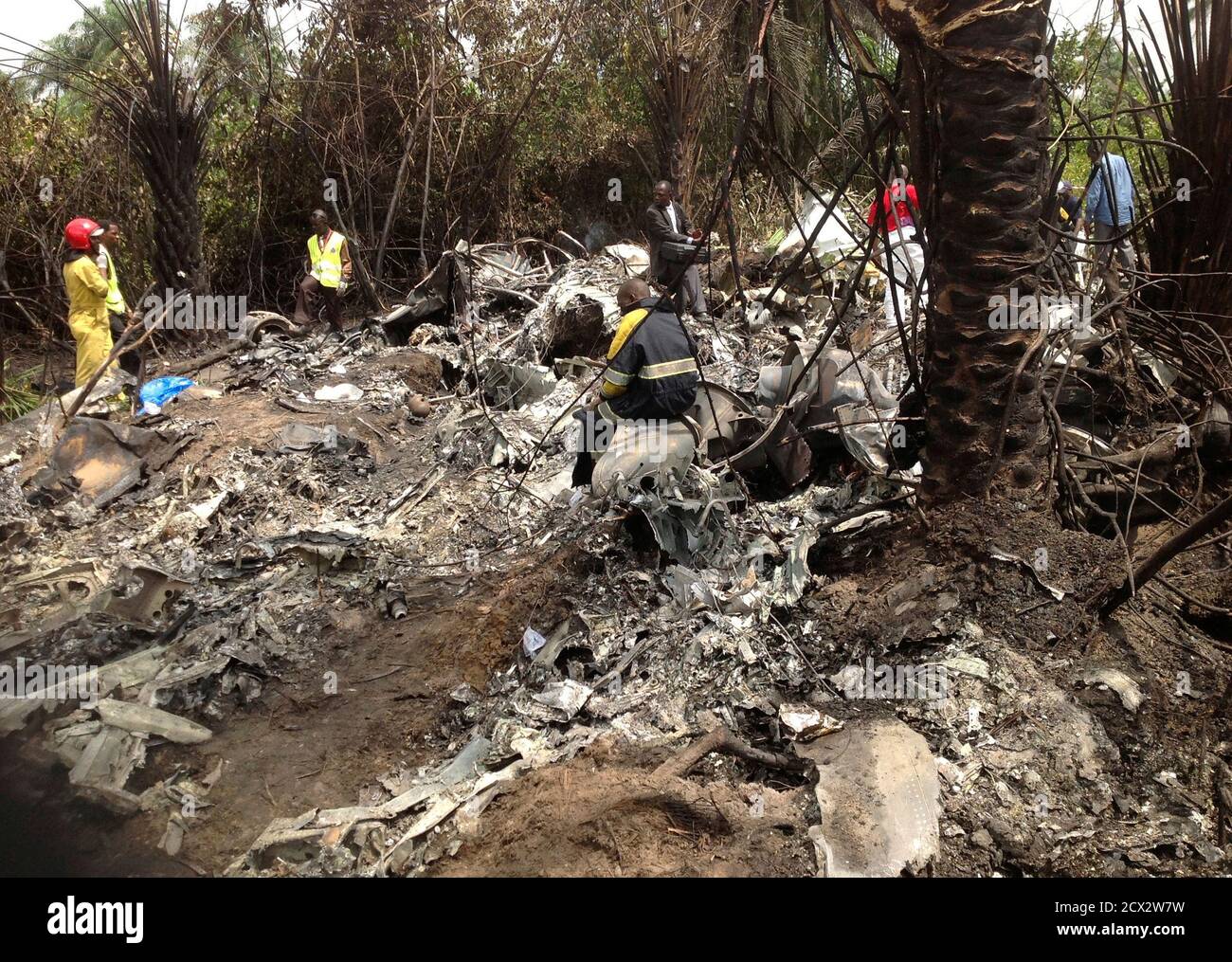 Rescue workers gather at the site where a plane carrying Guinea's military  chief, General Kelefa Diallo, and other senior military officials from the West  African state crashed in Charlesville, some 40 km (