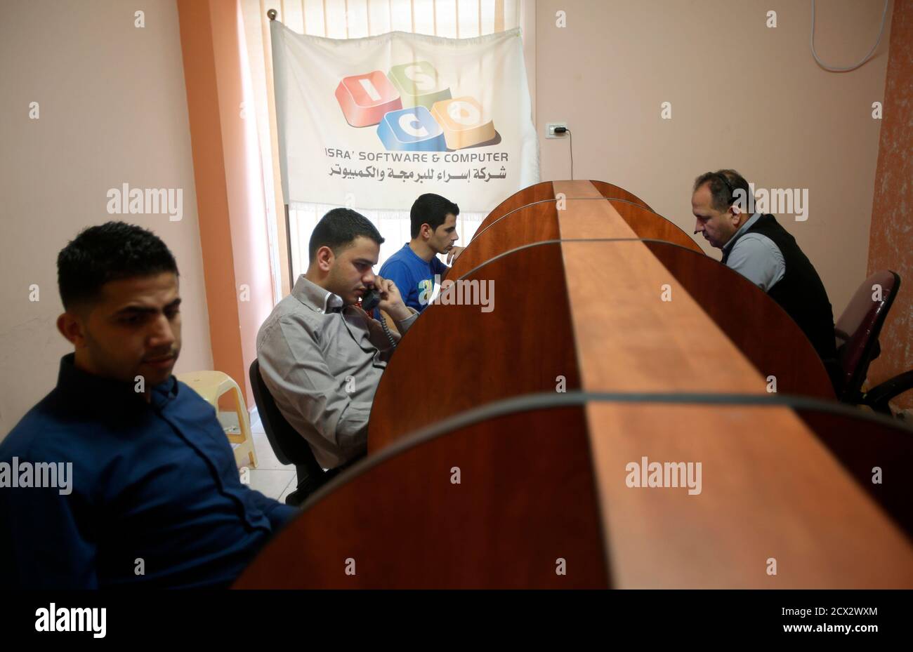 Employees work at Isra Software & Computer Co., an e-commerce firm in the  West Bank city of Nablus April 8, 2013. Fledgling Palestinian high-tech  firms hope they can now help revitalise the