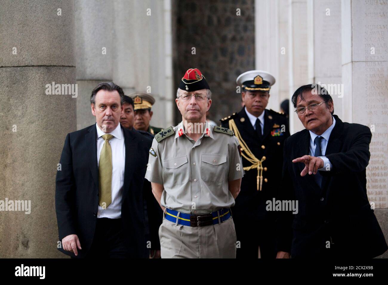 Britain's Chief of Defence Staff, General David Richards (C), visits Taukkyan war cemetery on the outskirts of Yangon, June 4, 2013. The cemetery is a memorial to Commonwealth soldiers who died in Burma, presently known as Myanmar, during World War Two. REUTERS/Minzayar (MYANMAR - Tags: MILITARY POLITICS CONFLICT) Stock Photo