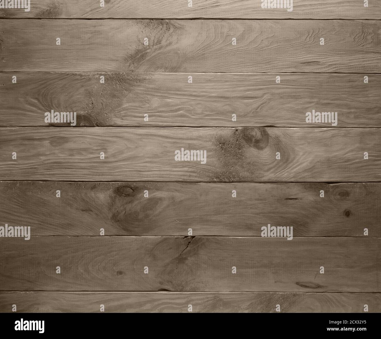 Empty handmade background made of natural wooden planks toned in warm gray color shades. Surface has textured scratches, spots and stains. Horizontal Stock Photo