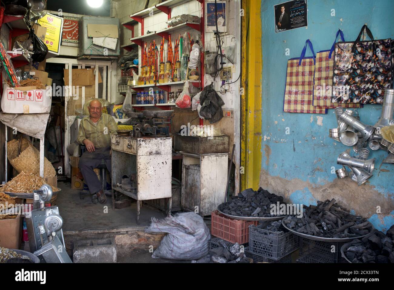 Shopseller with various grades of charcoal for sale. Shiraz, Iran Stock