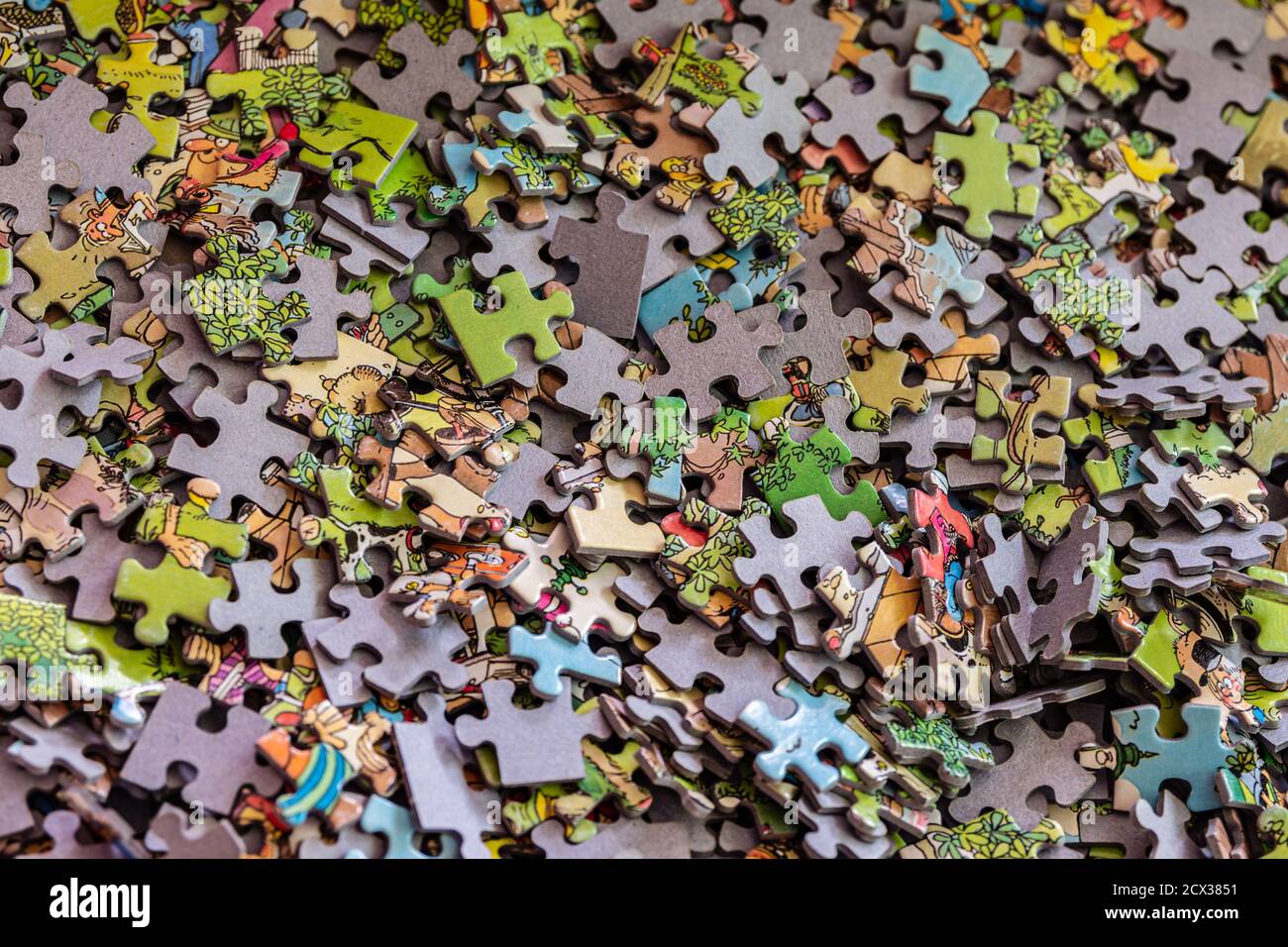 Puzzle pieces in a cardboard box Stock Photo