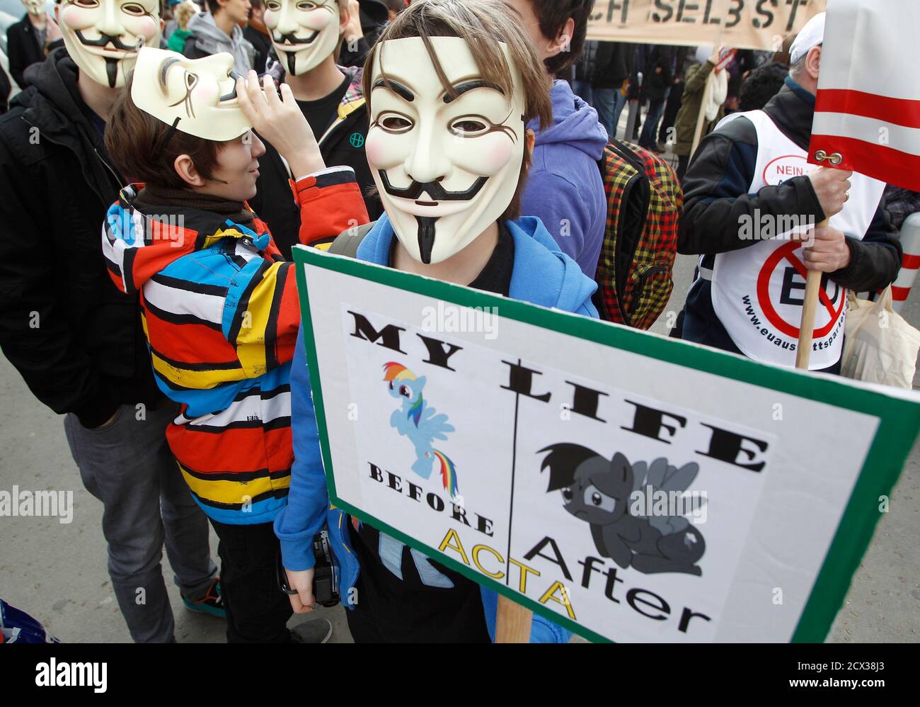Protesters wearing Guy Fawkes masks, made popular by the graphic novel "V for Vendetta", take part in a demonstration against ACTA (Anti-Counterfeiting Trade Agreement) in Vienna, February 25, 2012. Protesters fear that ACTA, which aims to cut trademark theft and other online piracy, will curtail freedom of expression, curb their freedom to download movies and music for free and encourage Internet surveillance. REUTERS/Lisi Niesner (AUSTRIA - Tags: POLITICS CIVIL UNREST) Stock Photo